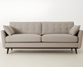 Beige sofa with two cushions on a white background