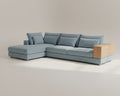 Blue sectional sofa with wooden armrests on a beige background