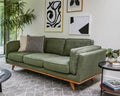 Modern living room with a green sofa, abstract art 